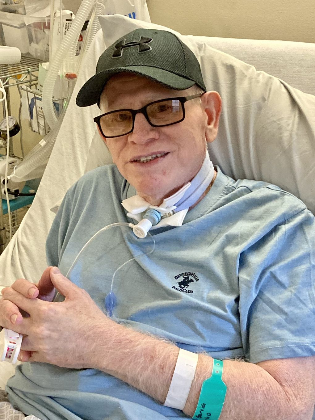 After being taken off a ventilator, Hector Garcia had a speaking valve put in to allow air to reach his vocal cords. Along with church duties, he also hosted a radio show. (Courtesy of Lizbeth Garcia)