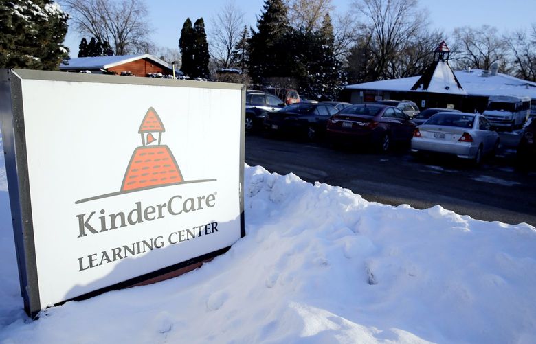 Snow rests at the bottom of a KinderCare Learning Center sign on East Palatine Road, Thursday, Feb. 5, 2015, in Palatine, Ill. Public health officials say students, staff and faculty at the facility have been notified and anyone who hasn’t been vaccinated for measles has been instructed to stay away from unvaccinated individuals for the next three weeks after lab tests confirm measles in children from the day care. (AP Photo/Nam Y. Huh)