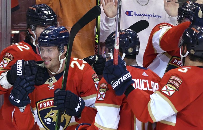 Florida Panthers left wing Carter Verhaeghe (23) celebrates a goal with teammates during the second period of the team’s NHL hockey game against the Colorado Avalanche Oct. 21 in Sunrise, Fla.