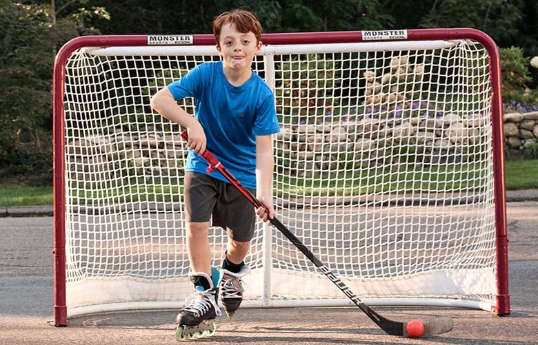 A month after Dante DeMaino left the hospital, doctors examined his heart with an echocardiogram to check for lingering heart damage from MIS-C. To his mother’s relief, his heart had returned to normal. Now, more than six months later, Dante is an energetic 10-year-old who has resumed playing hockey and baseball, swimming and rollerblading. (Philip Keith/Kaiser Health News/TNS) 30232120W 30232120W