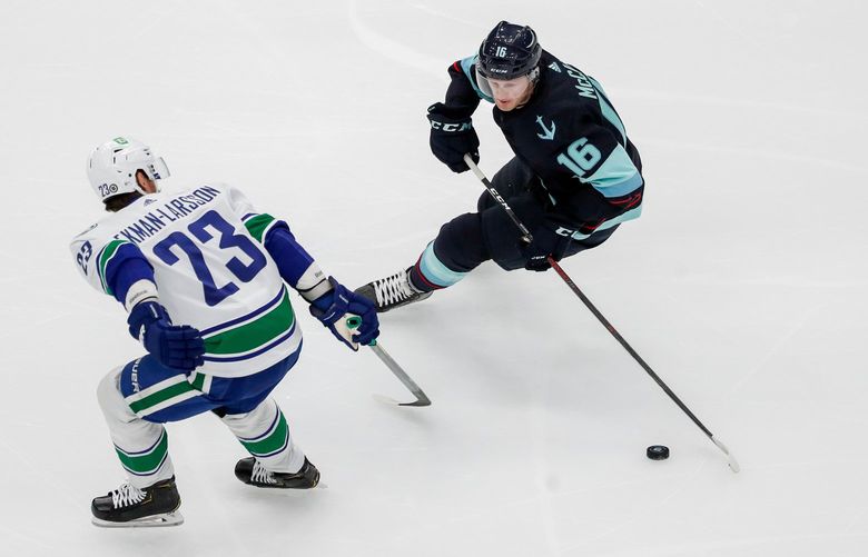 Climate Pledge Arena – Seattle Kraken vs. Vancouver Canucks- 102321
Seattle Kraken left wing Jared McCann handles the puck around Vancouver Canucks defenseman Oliver Ekman-Larsson during the first period Saturday Oct. 23, 2021, in Seattle. 218520