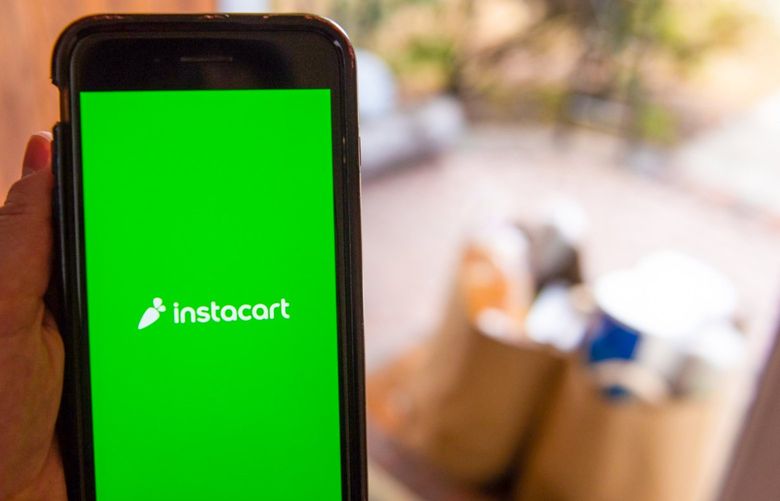 The Instacart logo on a smartphone arranged in Hastings-on-Hudson, New York, U.S., on Monday, Jan. 4, 2021. A booming market for U.S. initial public offerings shows no sign of slowing in 2021. Grocery-delivery company Instacart Inc. is preparing for a listing, according to people familiar with the matter. Photographer: Tiffany Hagler-Geard/Bloomberg 775609130