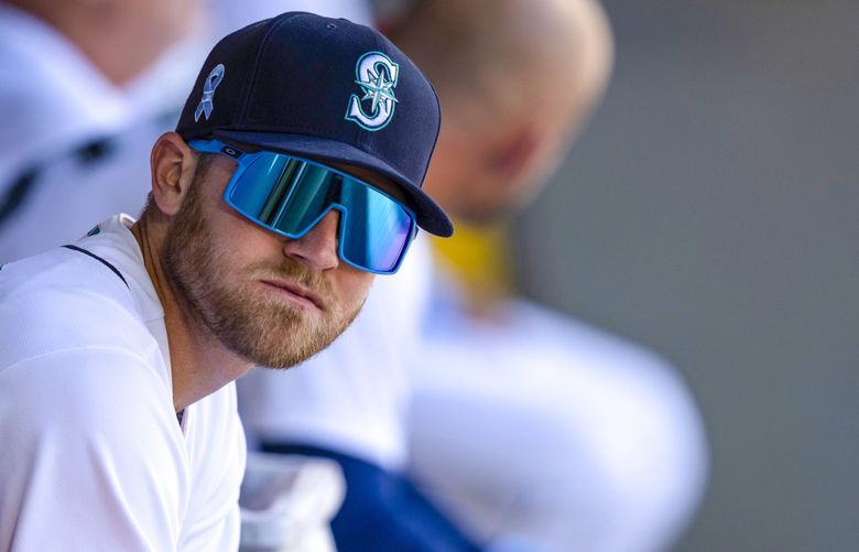 Seattle Mariners’ Jake Bauers sits in the dugout before a baseball game against the Tampa Bay Rays, Sunday, June 20, 2021, in Seattle. The Mariners won 6-2 in 10 innings. (AP Photo/Stephen Brashear) _SB13358