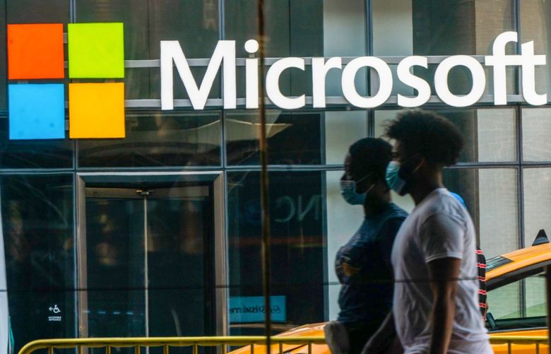Pedestrians wearing protective masks walk past a Microsoft Technology Center in New York, U.S., on Wednesday, July 22, 2020. Microsoft Corp. is set to post quarterly results after the closing bell and the tech bellwether’s performance will likely uphold its standing as a darling of Wall Street. 775538623