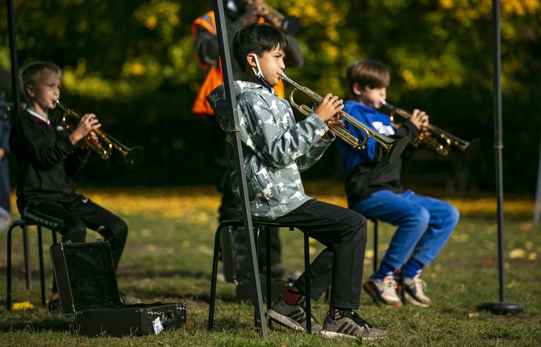 Fourth grader Liam Domaoan, center, (cq) plays with the rest of the class during rehearsal outside The Meridian School on Wednesday, Oct. 20, 2021.