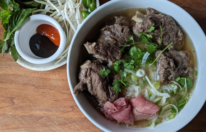 Pho Joe’s offers substantial bowls of pho, the broth slicked with fat and bobbing with a wide, flat rice noodle, beef ribs and rare beef.