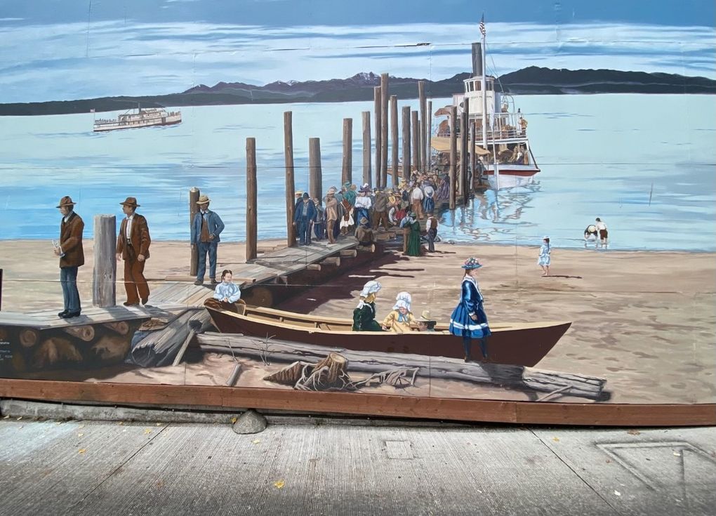 The mural “Mosquito Boat Landing” by Susan Tooke in West Seattle illustrates the arrival at Alki of the paddle-wheel ship S.S. Clan McDonald, which provided ferry transport around Puget Sound at the turn of the 20th century. (Carol Pucci / Special to The Seattle Times)