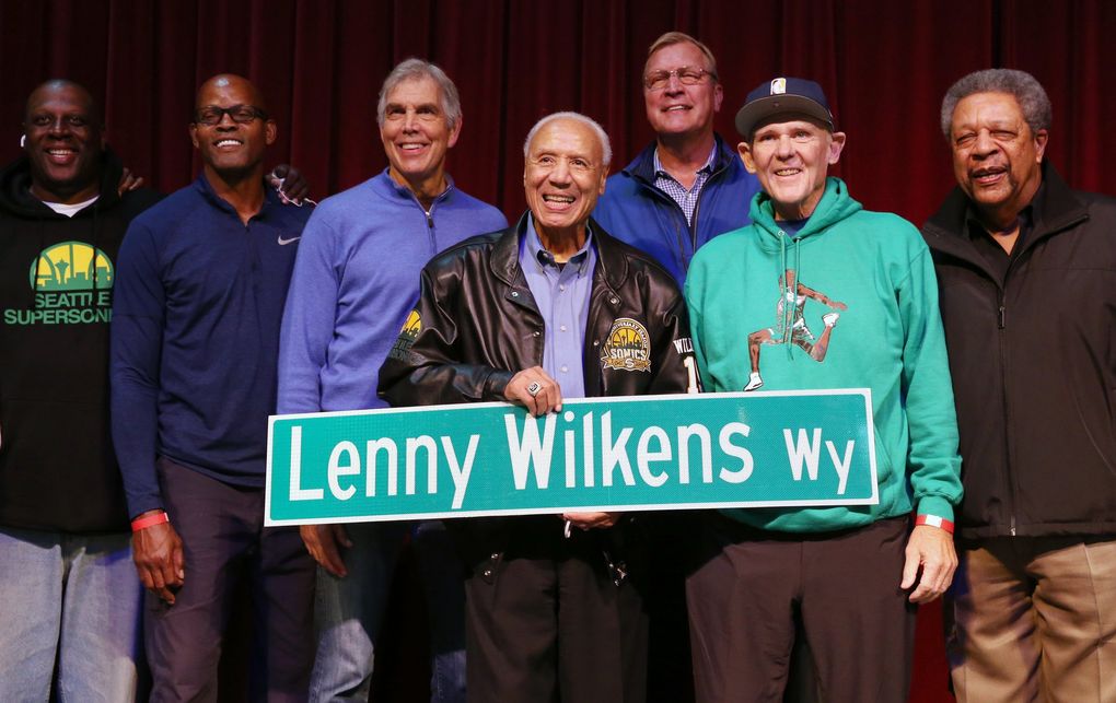 Lenny Wilkens, center, stands with fellow Sonics and a replica of “Lenny Wilkens Way” at Seattle Center Armory, Thursday. (Ken Lambert / The Seattle Times)