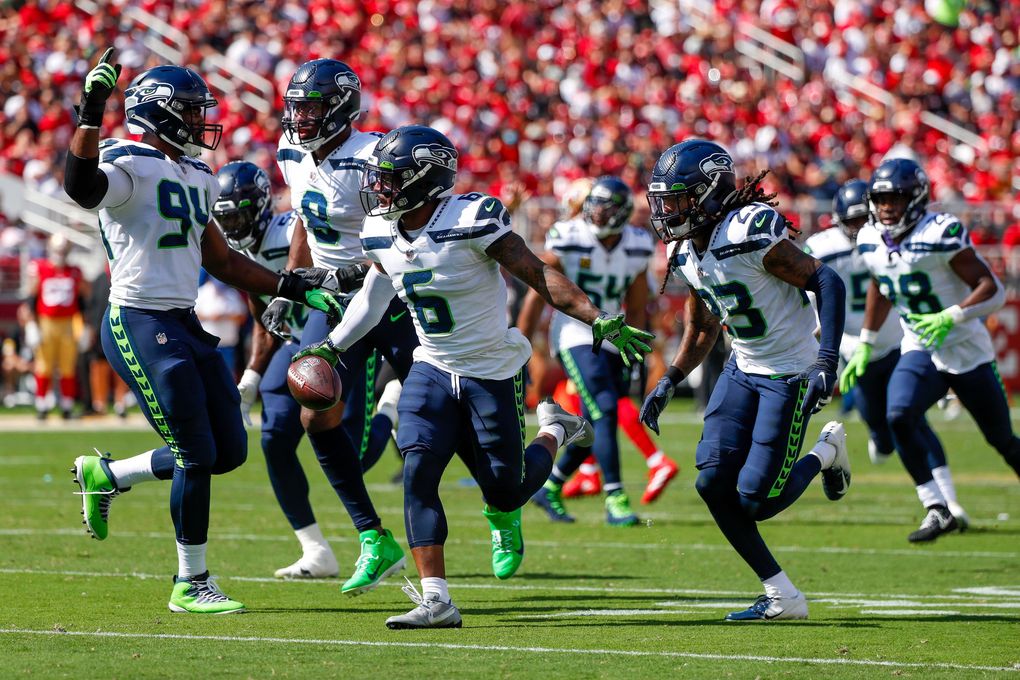 Seattle Seahawks strong safety Quandre Diggs celebrates an interception during the first quarter Sunday, Oct. 3, 2021, in Santa Clara, Calif. (Jennifer Buchanan / The Seattle Times)