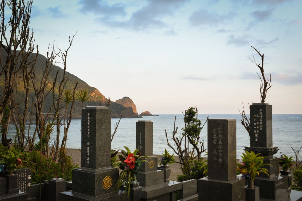 Two strong typhoons in 2014 washed away the beach and uprooted the pandanus trees that protected the village of Katoku, leaving the cemetery perched precariously above the tattered strand. (Noriko Hayashi / The New York Times)
