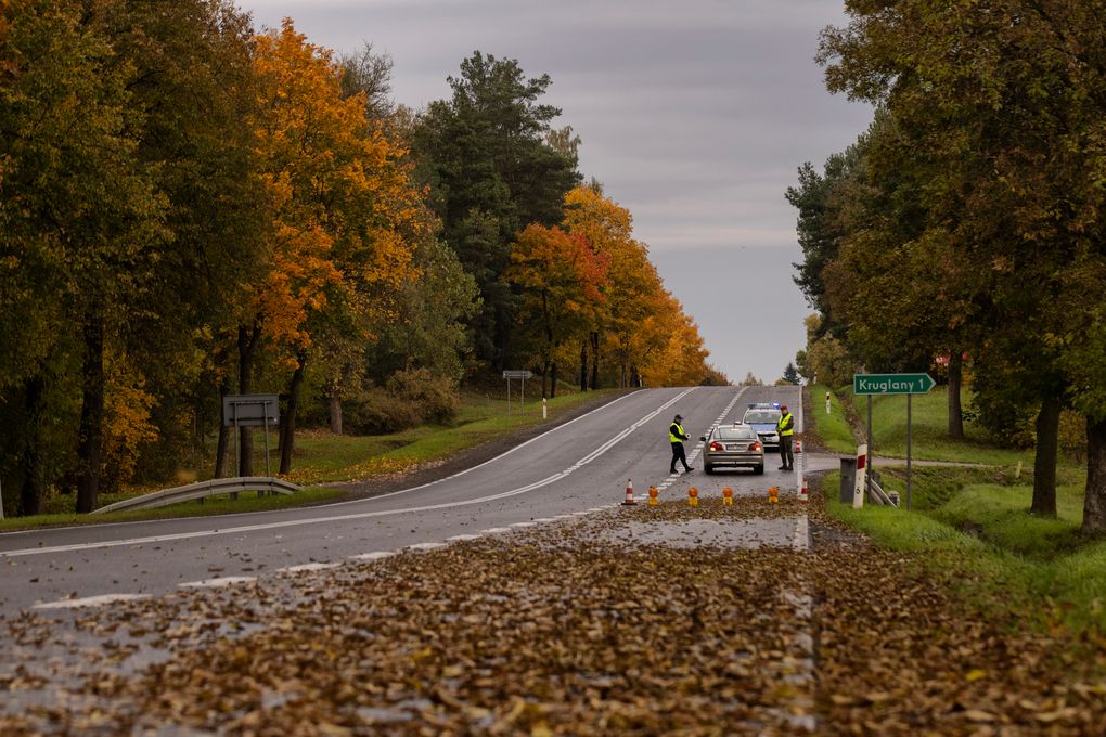A police checkpoint in the exclusion area near Poland’s border with Belarus on Oct. 2, 2021. Poland’s right-wing government, determined to keep out refugees and economic migrants, has flooded the eastern border area with security agents, while keeping out prying eyes by declaring it an emergency exclusion zone off limits to all but residents. (Maciek Nabrdalik / The New York Times)