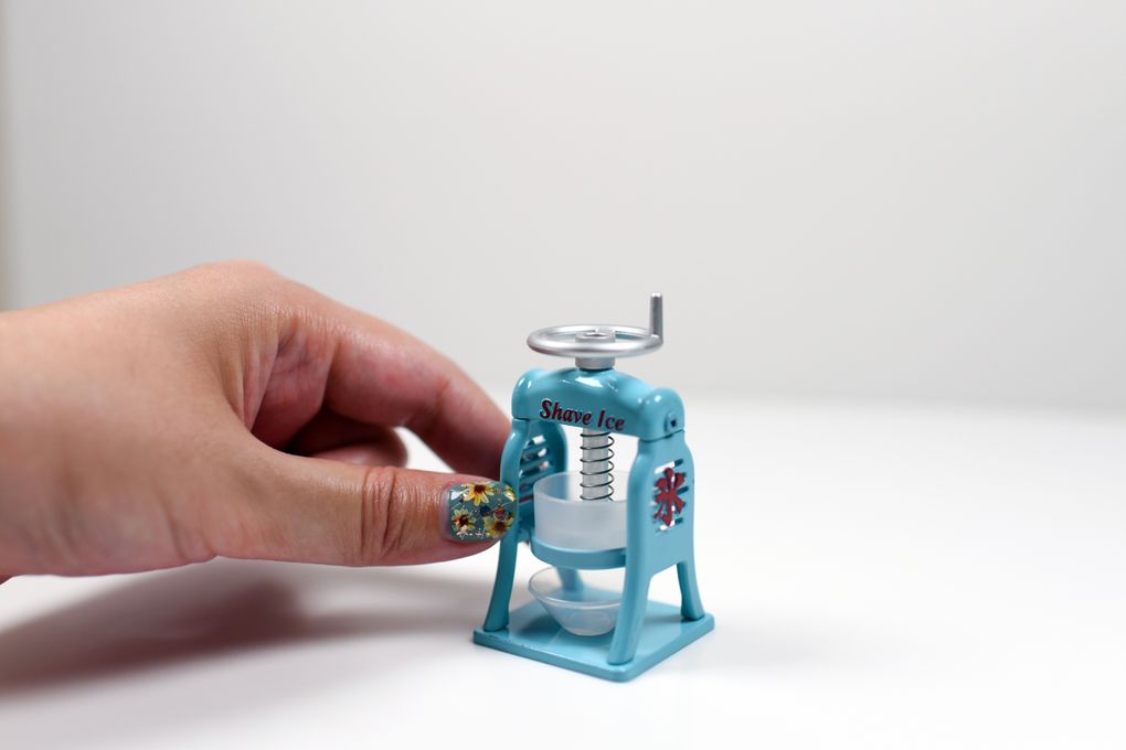 A miniature machine which produces real shaved ice, made by Toys Cabin, is displayed in the company’s offices in Shizuoka, Japan. The popular, pint-size reproductions of everyday items feel like a metaphor for COVID-era life. (Noriko Hayashi / The New York Times)