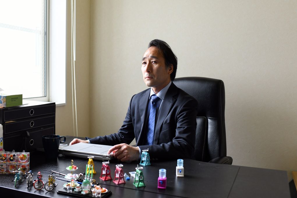 Keita Nishimura at his desk in his Tokyo office on Sept. 17. The challenge of making gachapon lured Nishimura from a leading toymaker to Toys Spirits, where he is chief executive. (Noriko Hayashi / The New York Times)