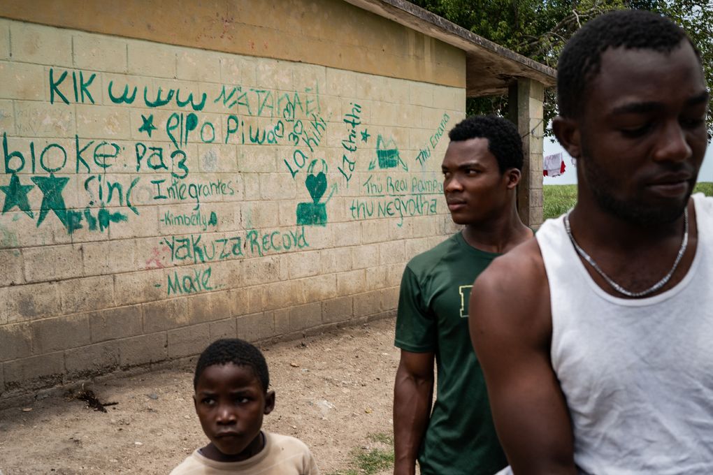 Young men gather at Central Romana housing known as bateyes, dank shacks that often lack electricity and running water, near the town of El Seibo, Dominican Republic, on May 27, 2021. (Washington Post photo by Salwan Georges)