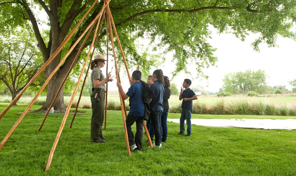 A ranger talks with young visitors during an activity at Whitman Mission National Historic Site near Walla Walla. (Courtesy of the Walla Walla Union-Bulletin)