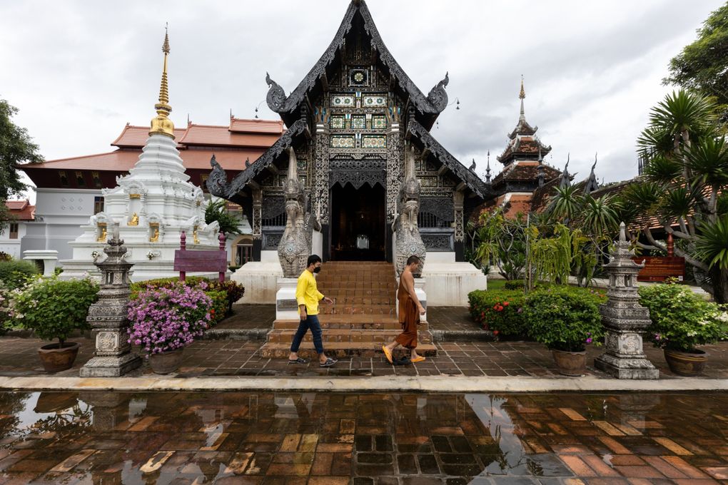 A monk walks through a near empty Wat Chedi Luang in Chiang Mai, Thailand. (Bloomberg photo by Luke Duggleby).