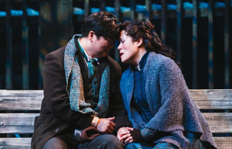 Yosep Kang as Rodolfo and Karen Vuong as Mimi in Seattle Opera’s production of “La Boheme.”