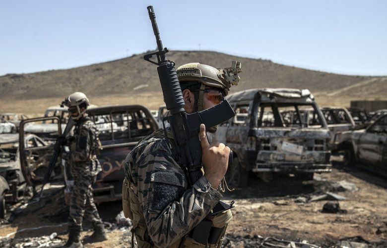 FILE – Members of the Taliban 313 Badri Unit, with American weapons, patrol a former CIA base in Kabul on Sept. 6, 2021. The Taliban seized troves of American weapons and vehicles from surrendering Afghan soldiers. (Victor J. Blue/The New York Times)