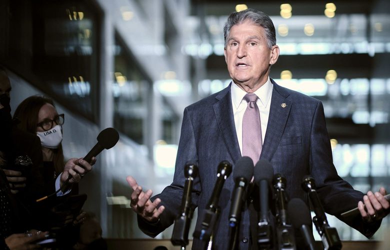 FILE â€” Sen. Joe Manchin (D-W.Va.) speaks to reporters on Capitol Hill in Washington on Wednesday, Oct. 6, 2021, ahead of an expected vote in the Senate on the debt limit. The West Virginia Democrat told the White House he is firmly against a clean electricity program that is the muscle behind the presidentâ€™s plan to battle climate change. (T.J. Kirkpatrick/The New York Times) XNYT152 XNYT152