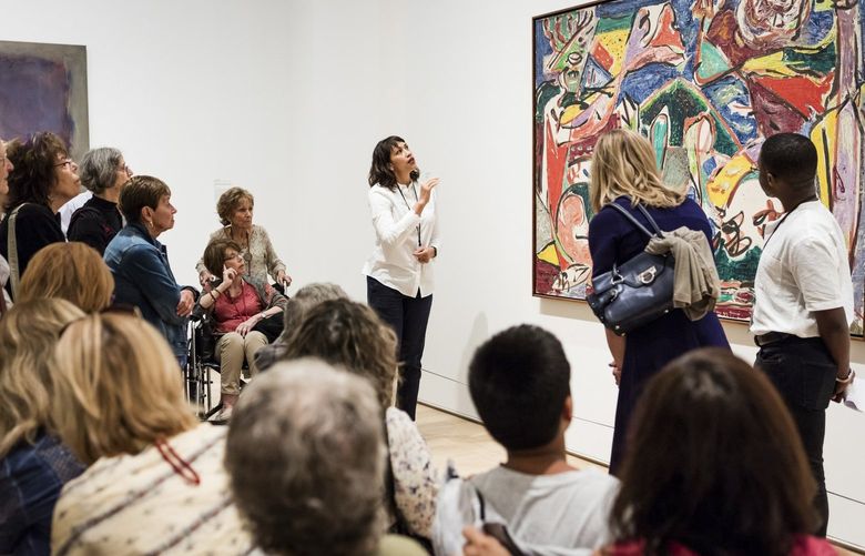 In an undated photo from the Art Institute of Chicago, a docent guides a group at the Art Institute of Chicago. The museum’s decision to dismiss its volunteer educators and create a program that “responds to issues of class and income equity” has drawn criticism. (Art Institute of Chicago via The New York Times) — NO SALES; FOR EDITORIAL USE ONLY WITH NYT STORY DOCENTS DIVERSITY BY ROBIN POGREBIN FOR OCT. 21, 2021. ALL OTHER USE PROHIBITED. —