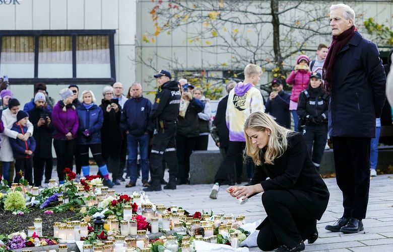 Norway’s Prime Minister Jonas Gahr Stoere, right, and Minister of Justice and Emergency Management Emilie Enger Mehl lay flowers and light candles to honor the four women and a man who died in Wednesdayâ€™s bow and arrow attack in Kongsberg, Norway, Friday Oct. 15, 2021. (Terje Bendiksby/NTB via AP) LBJ806 LBJ806