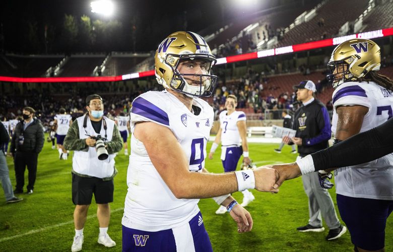 Dylan Morris is congratulated by teammates after taking the Huskies down the field on a winning drive in the 4th quarter.
.
The Washington Huskies played the Stanford Cardinal in Pac-12 Football Saturday, October 30, 2021, at Stanford Stadium, in Palo Alto, CA. 218682