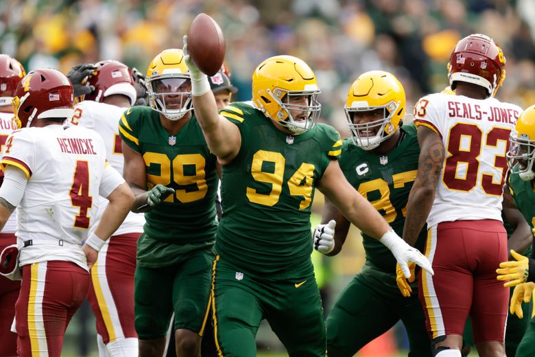 Green Bay Packers' Preston Smith celebrates his interception with