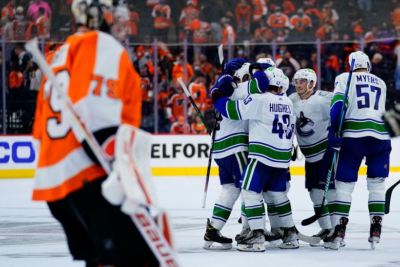 Flyers beat Canucks in home opener 