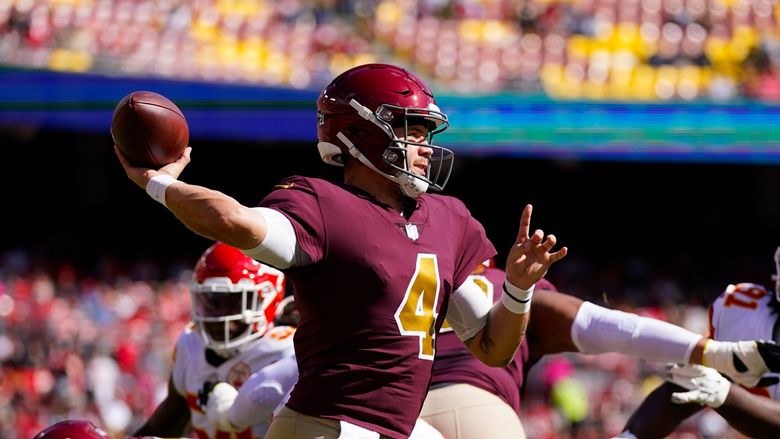 Washington Football Team quarterback Taylor Heinicke (4) throws the ball  during the first half …