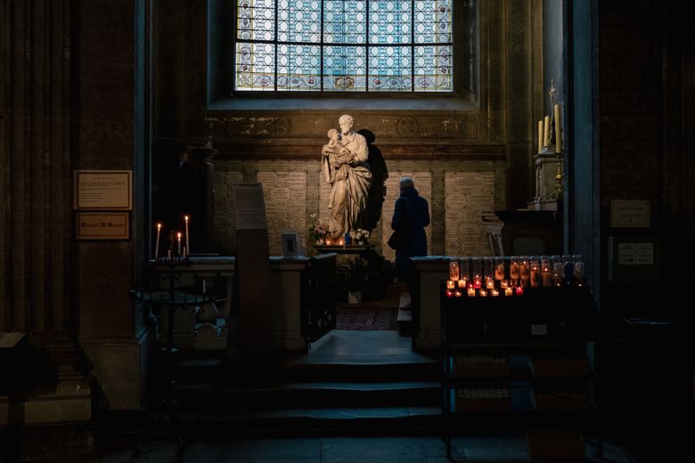 A visitor prays at the Church of Saint-Sulpice in Pari in October. A church-ordered report issued in October by an independent commission on sexual abuse inside the French Catholic Church found that the sacrament of confession itself, in rare instances, had been used to cover up abuse cases. (Dmitry Kostyukov / The New York Times)