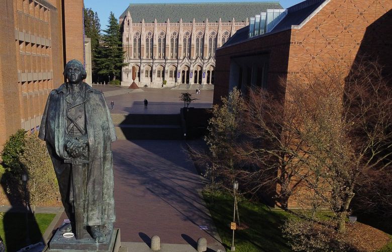 The University of Washington’s shutdown campus shows a virtually empty Red Square in the background, Monday afternoon, March 16, 2020 in Seattle as the coronavirus outbreak continues. 213372