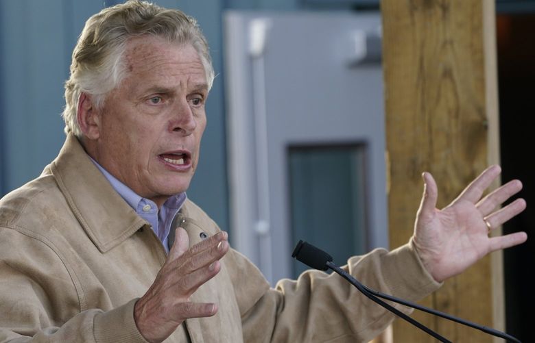 Democratic gubernatorial candidate former Gov. Terry McAuliffe, gestures as he speaks to supporters during a rally in Richmond, Va., Monday, Nov. 1, 2021. McAuliffe will face Republican Glenn Youngkin in the November election. (AP Photo/Steve Helber) VASH116 VASH116