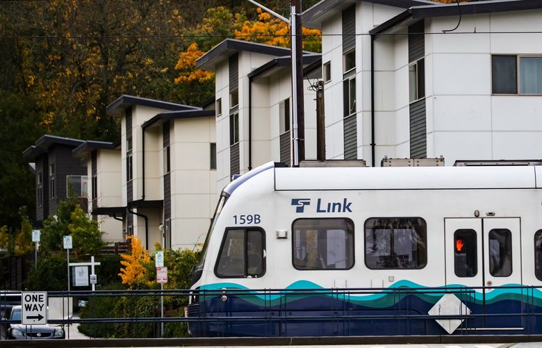 A southbound light rail train passes by relatively new housing at Martin Luther King Way South and South Trenton Street near the Rainier Beach station.

The area around the Rainier Beach light rail station Friday October 29, 2021. 218671