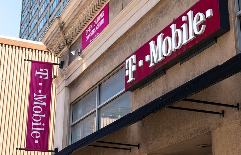 Signage for a T-Mobile store in San Francisco, California, U.S., on Tuesday, March 16, 2021. T-Mobile US Inc. is kicking off a bond sale to help finance the purchase of new high-speed spectrum licenses as carriers roll out the next generation of mobile devices. Photographer: David Paul Morris/Bloomberg