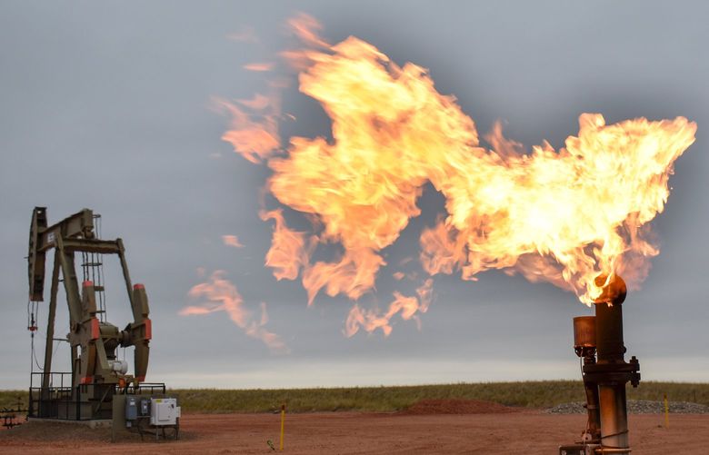 FILE – In this Aug. 26, 2021 file photo, a flare burns natural gas at an oil well Aug. 26, 2021, in Watford City, N.D. The world’s facing an energy crunch. Europe is feeling it worst as natural gas prices skyrocket to five times normal, forcing some factories to hold back production. Reserves depleted last winter haven’t been made up, and chief supplier Russia has held back on supplying extra. Meanwhile, the new Nord Stream 2 gas pipeline won’t start operating in time to help if the weather is cold, and there’s talk Europe could wind up rationing electricity. China is feeling it too, seeing power outages in some towns. (AP Photo/Matthew Brown, file) LON502