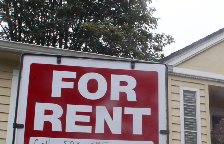 This 2011, photo shows a house for rent and for sale sign in front of a home in Portland, Ore. (AP Photo/Rick Bowmer)