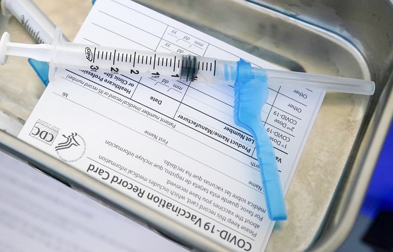 FILE – This May 13, 2021, file photo shows syringes filled with the Johnson & Johnson vaccine at a mobile vaccination site in Miami. Starting Thursday, Oct. 14, 2021, the Food and Drug Administration convenes its independent advisers for the first stage in the process of deciding whether extra shots of  Moderna or Johnson & Johnson vaccines should be dispensed and, if so, who should get them and when. (AP Photo/Wilfredo Lee, File) NYAG203