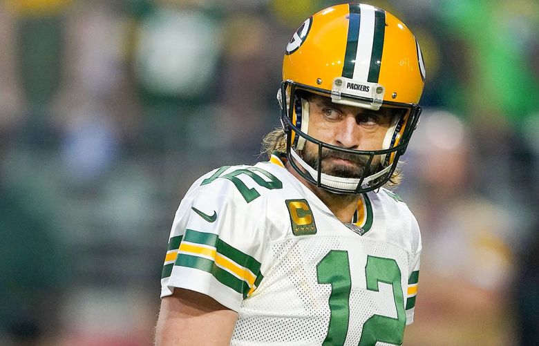 Green Bay Packers quarterback Aaron Rodgers (12) looks back against the Arizona Cardinals in the first half of an NFL football game Thursday, Oct. 28, 2021, in Glendale, Ariz. (AP Photo/Darryl Webb) NYOTK