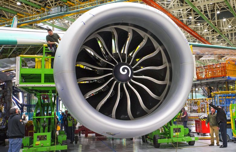The biggest jet engines ever seen are now hanging from the longest wings on any Boeing plane. Ahead of the new 777X jet’s rollout, Boeing offered a first look at these jaw-dropping GE-9X engines inside its Everett assembly plant.  208904 208904
