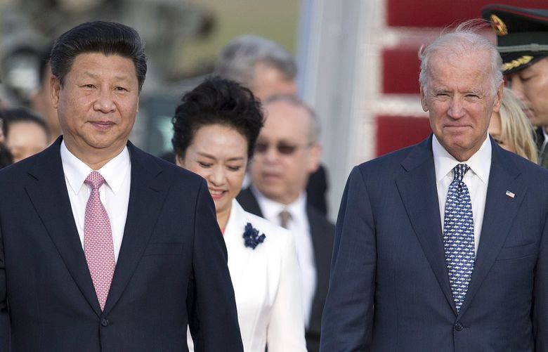 FILE – Chinese President Xi Jinping and Vice President Joe Biden walk down the red carpet on the tarmac during an arrival ceremony in Andrews Air Force Base, Md., Sept. 24, 2015. As President Joe Biden and Xi Jinping prepare to hold their first summit on Monday, Nov. 15, the increasingly fractured U.S.-China relationship has demonstrated that the ability to connect on a personal level has its limits. Biden nonetheless believes there is value in a face-to-face meeting, even a virtual one like the two leaders will hold Monday evening. (AP Photo/Carolyn Kaster, File) WX215 WX215