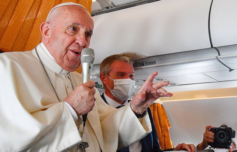 Pope Francis speaks with journalists on board an Alitalia aircraft enroute from Bratislava back to Rome, Wednesday, Sept. 15, 2021 after a four-day pilgrimage to Hungary and Slovakia. (Tiziana Fabi, Pool via AP) FP105