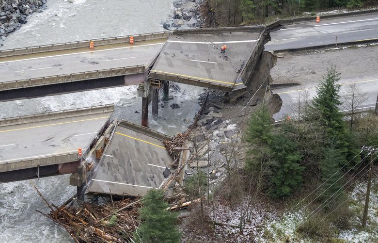 In this aerial photo, damage caused by heavy rains and mudslides earlier in the week is pictured along the Coquihalla Highway near Hope, British Columbia, Thursday, Nov. 18, 2021. (Jonathan Hayward/The Canadian Press via AP) JOHV125 JOHV125