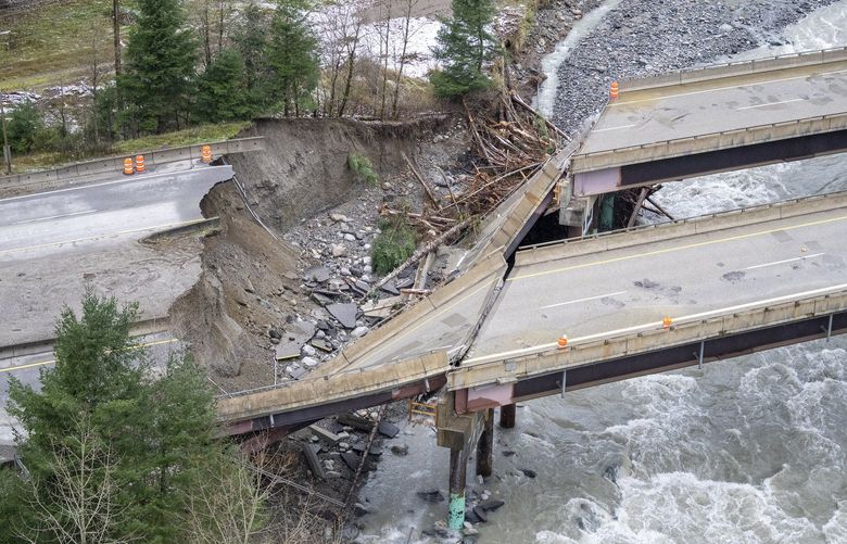 In this aerial photo, damage caused by heavy rains and mudslides earlier in the week is pictured along the Coquihalla Highway near Hope, British Columbia, Thursday, Nov. 18, 2021. (Jonathan Hayward/The Canadian Press via AP) JOHV126 JOHV126
