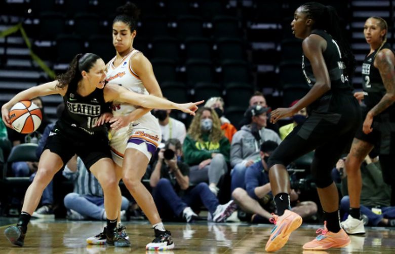 The Storm’s Sue Bird (10) directs teammates during first half playoff action against the Phoenix Mercury, Sunday, Sept. 26, 2021 in Everett. 218301
