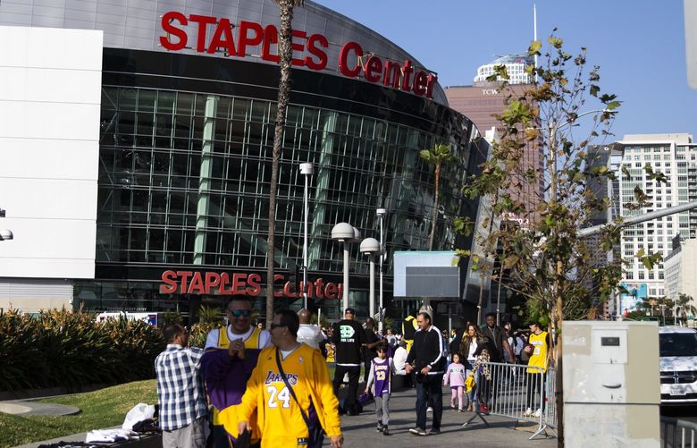 FILE — Mourners gather for Kobe Bryant, the retired Los Angeles Lakers star, outside of the Staples Center in Los Angeles, Jan. 26, 2020. A deal to rename the venue the Crypto.com Arena on Dec. 25, 2021, will cost the five-year-old company about $700 million. (Jenna Schoenefeld/The New York Times) XNYT156 XNYT156