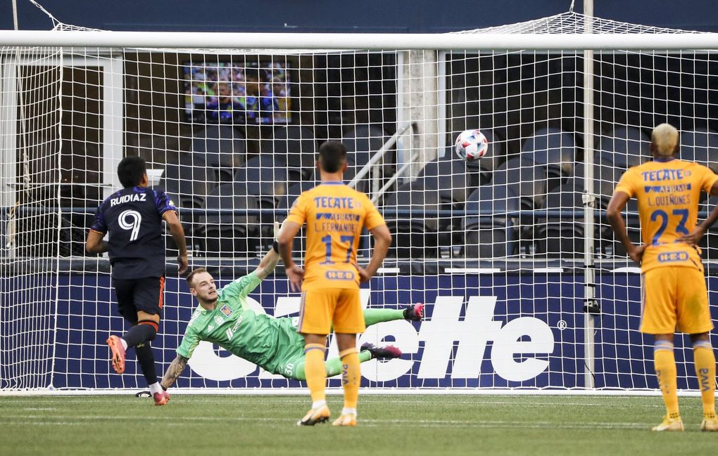 Seattle Sounders forward Raul Ruidiaz (9) scores from a penalty against UANL Tigres goaltender Miguel Ortega (30) during a game on Tuesday August 10, 2021 at Lumen Field in Seattle, Wash. (Amanda Snyder / The Seattle Times)