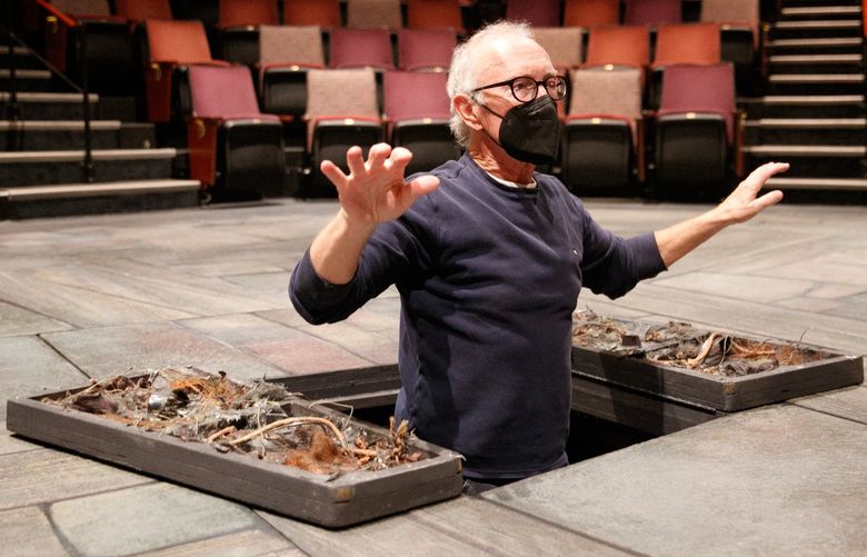 R. Hamilton Wright shows how the hydraulic lifts work to enter the stage of ‘A Christmas Carol’ at ACT Theatre in Seattle Monday, Nov. 15, 2021. Wright and Amy Thone will share the roles of Scrooge and Marley. 218580