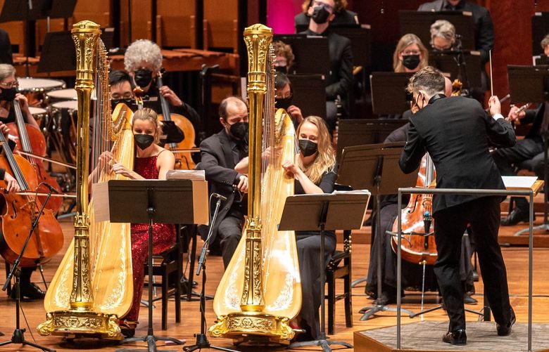 Harpists Valerie Muzzolini and Hannah Lash, with conductor Lee Mills and the Seattle Symphony, perform the world premiere of Lash’s “The Peril of Dreams,” a double harp concerto.