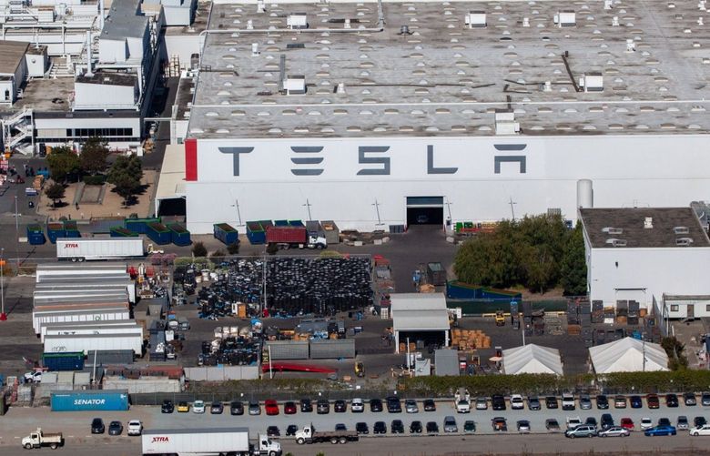 The Tesla Inc. assembly plant stands in this aerial photograph taken above Fremont, California, U.S., on Wednesday, Oct. 23, 2019. Tesla shares are trading above Wall Street expectations after spending most of the year languishing below analysts’ average price targets. Photographer: Sam Hall/Bloomberg