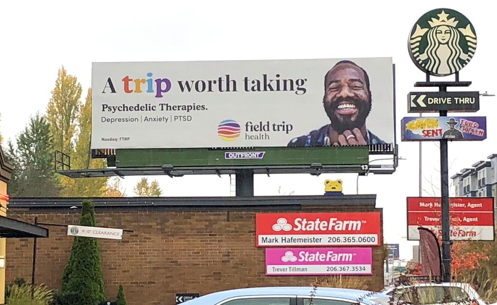 A billboard advertising for Field Trip Health, which opened a clinic last month in Seattle offering supervised treatments for mental illness with ketamine, in combination with talk therapy. (Frank Mina / The Seattle Times)